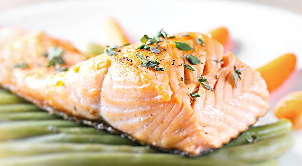 A close up of a plate with salmon